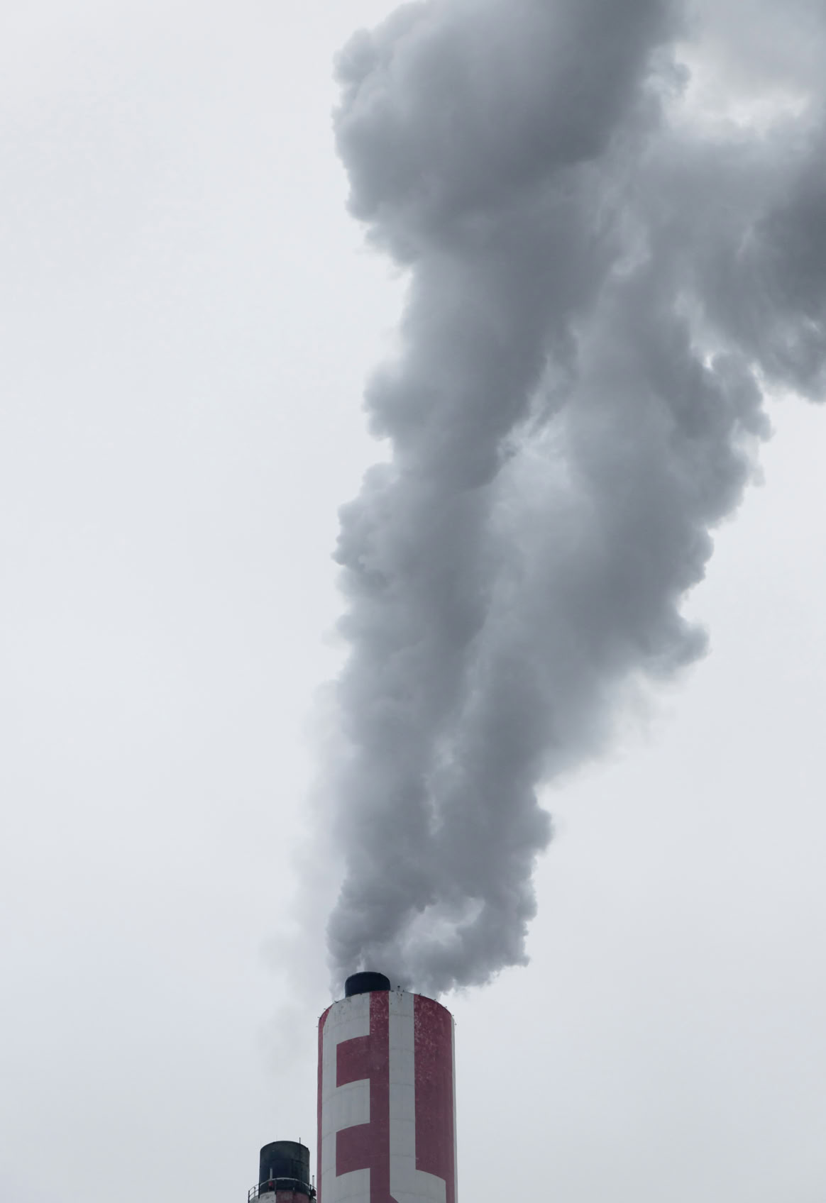 US Army soldier in a military uniform sitting indoors, discussing mental health support.